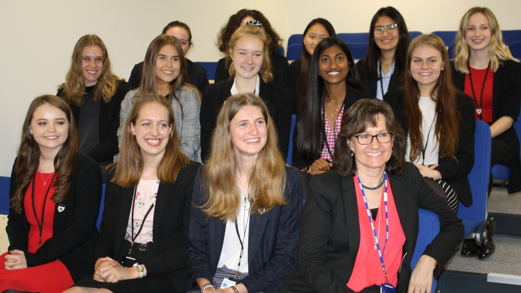 Chief Executive Officer Mrs. Marshall sits with a group of CCHSG Sixth Formers in the purpose built Lecture Theatre